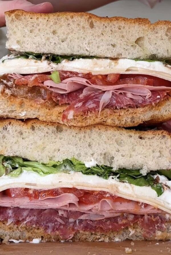 cross section close up of salami burrata sandwich