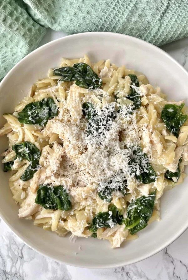 lemon chicken orzo in a white bowl