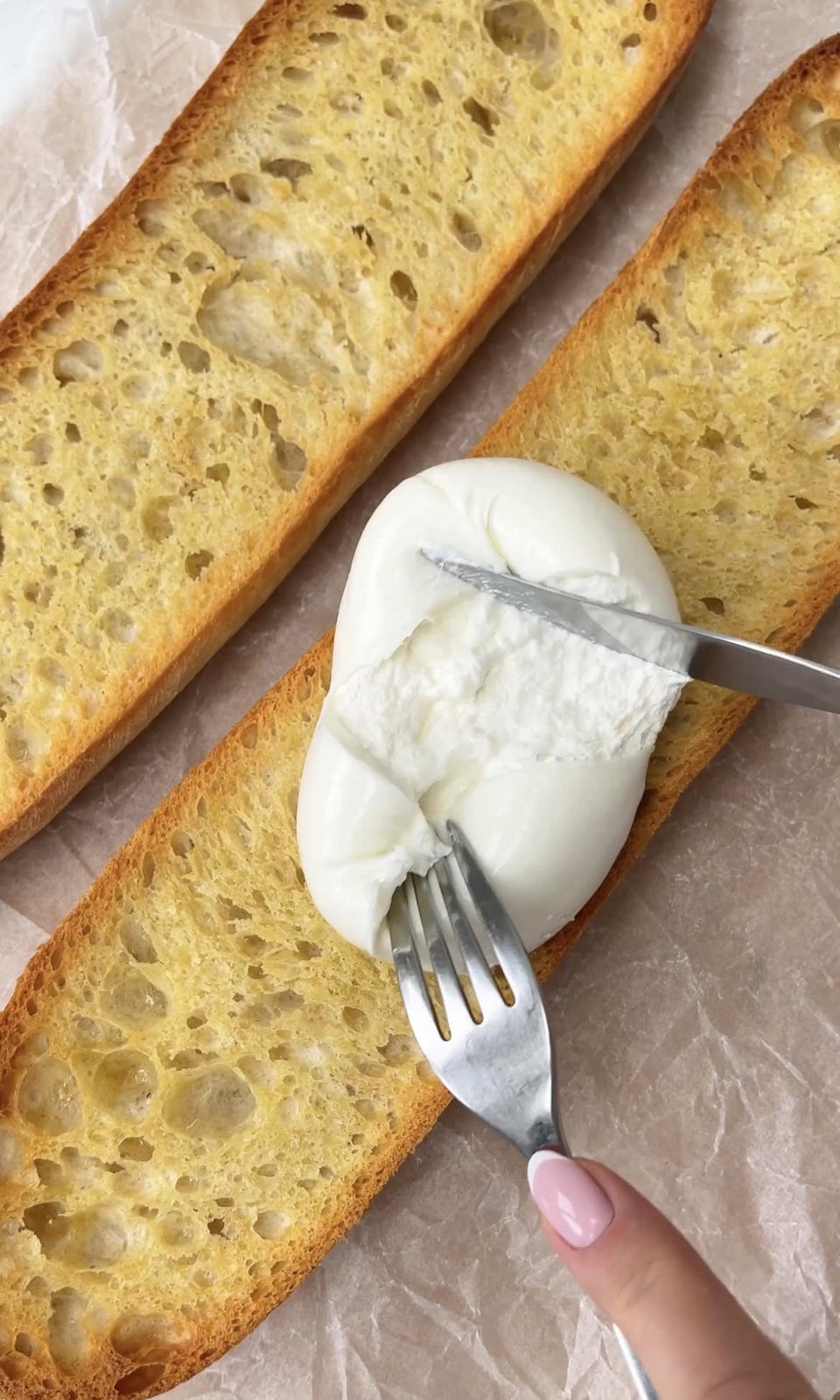 smoothing burrata on ciabatta.
