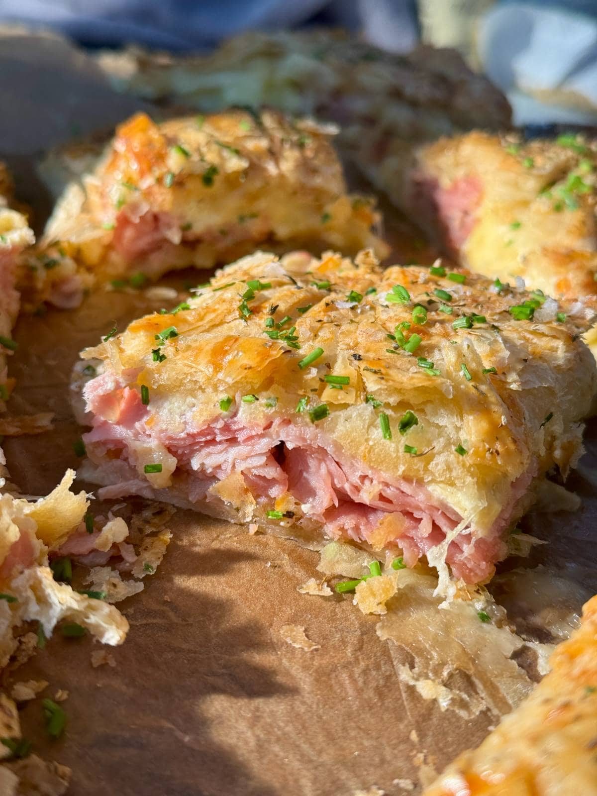 a slice of ham and cheese pithivier.