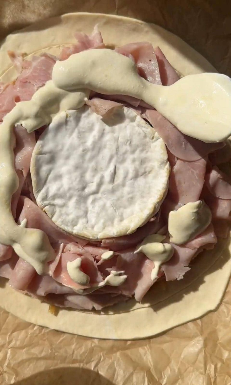 covering the pithivier with sour cream.