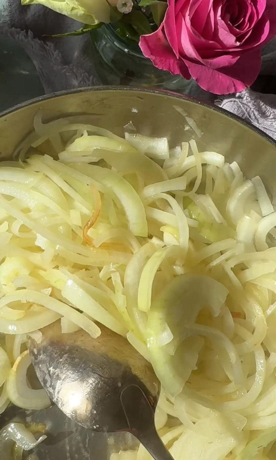 sliced onions in a pan.