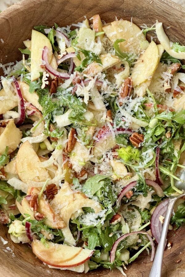 fennel apple salad in a wooden bowl.