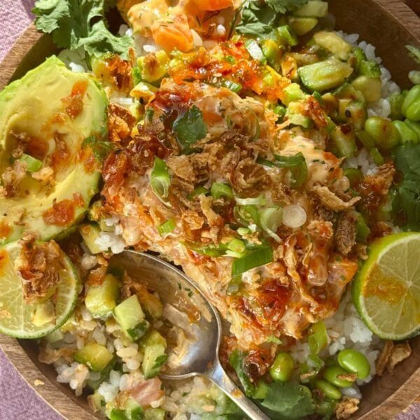 salmon bowls with sushi rice, lime and spring onion.