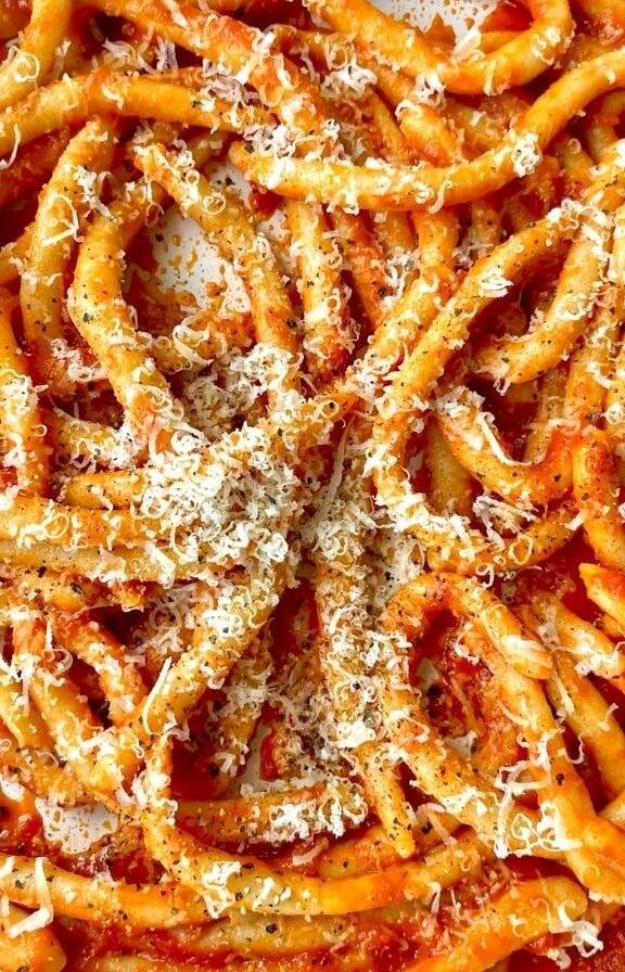 Tomato sauce tossed through pasta