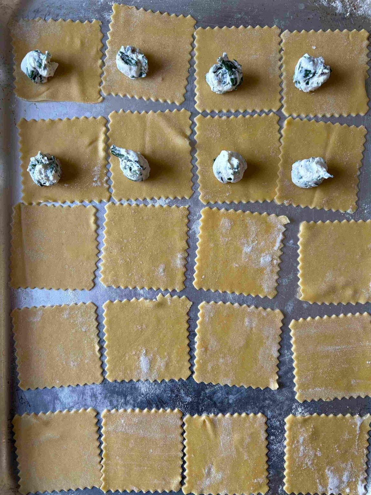 Filling triangoli with spinach ricotta.