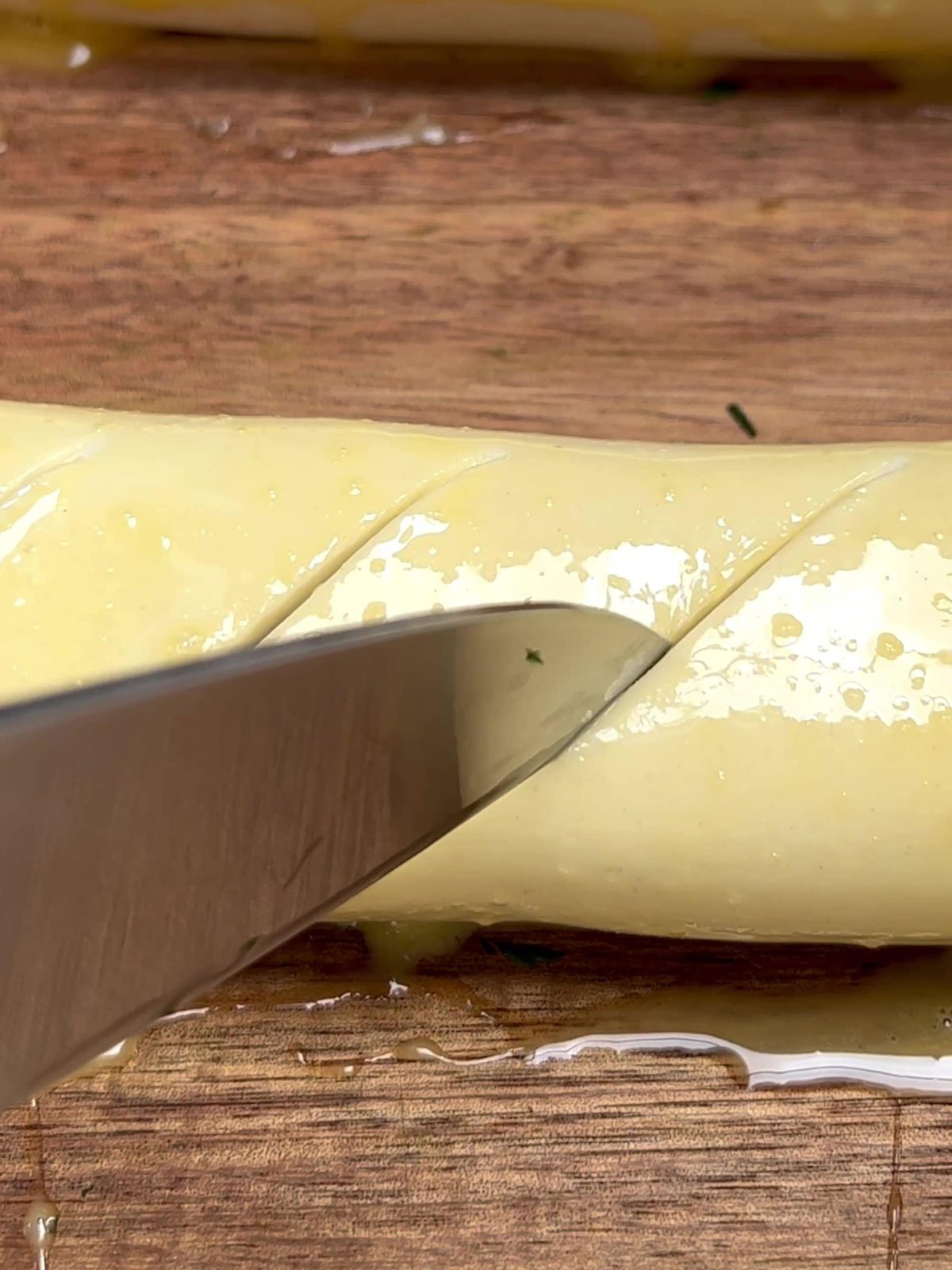Cutting pastry with sharp knife.