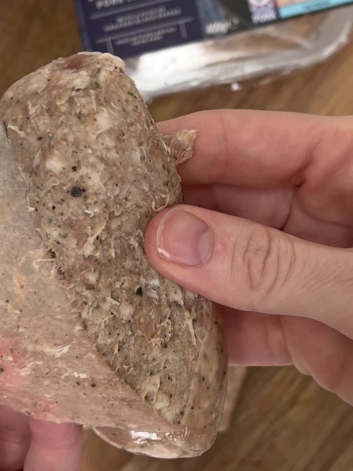 Removing sausage from the skin.