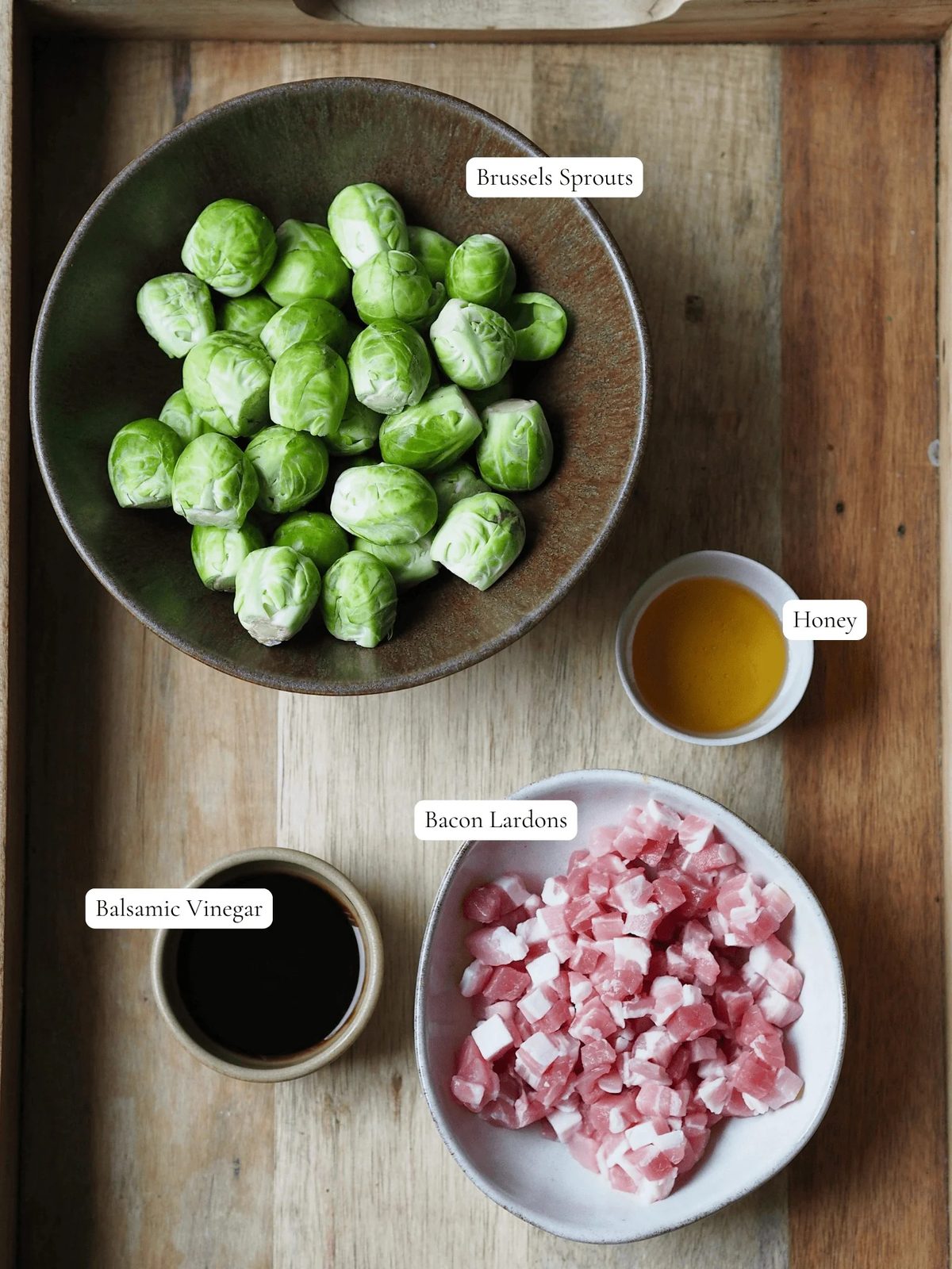Labeled ingredients to make Honey Bacon Balsamic Brussels Sprouts.