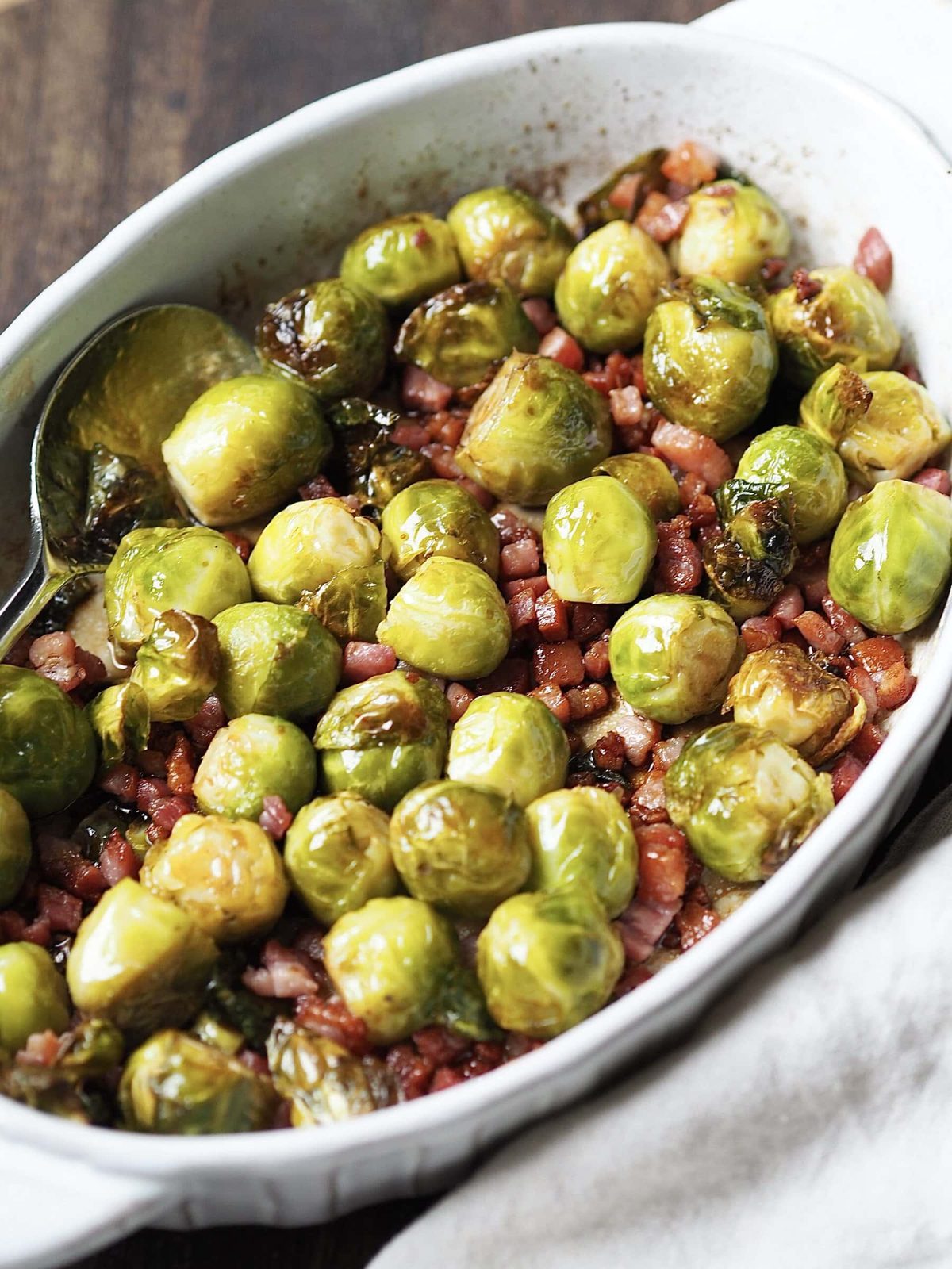 Roasted Brussels sprouts with cooked bacon lardons tossed in honey and balsamic vinegar.