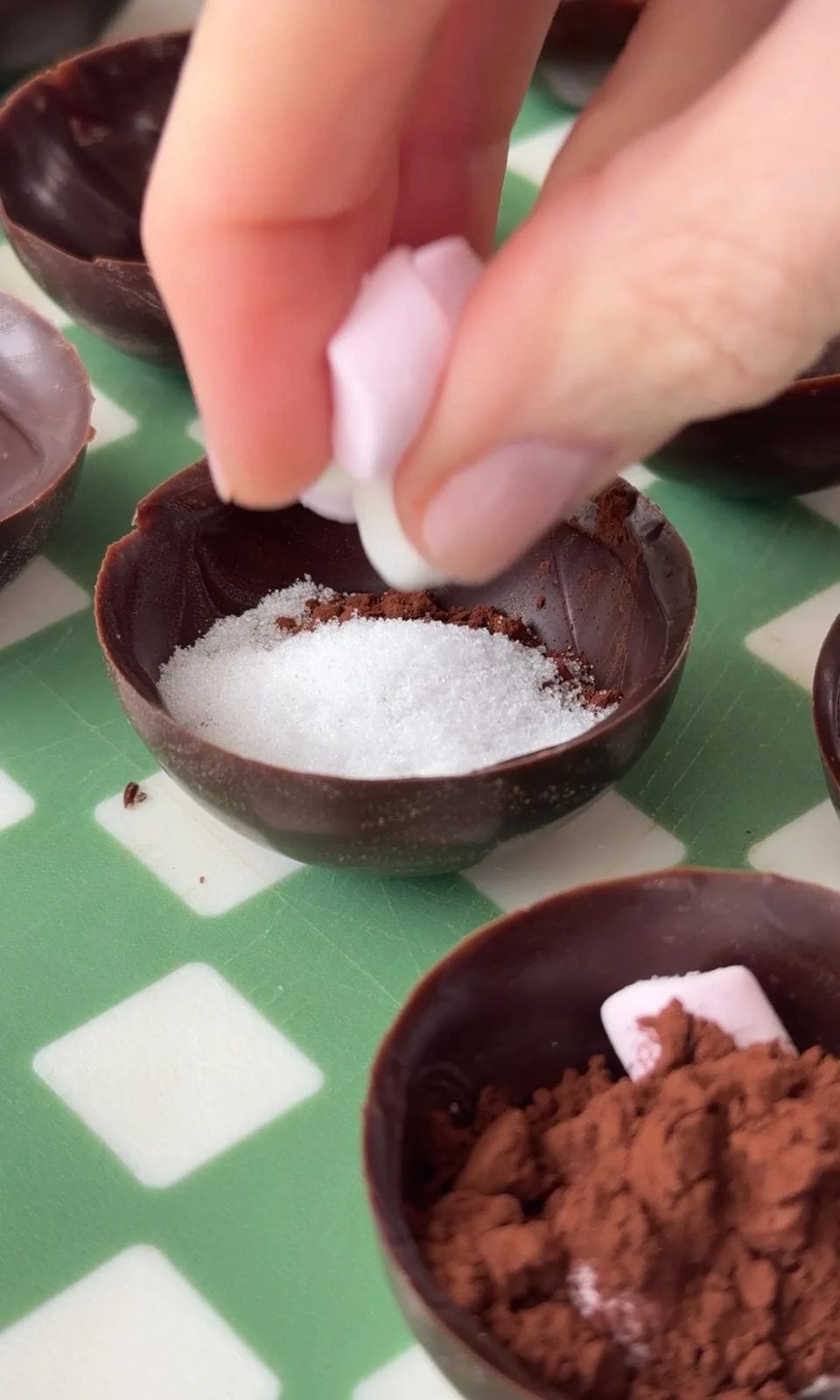 Filling hot chocolate bombs.