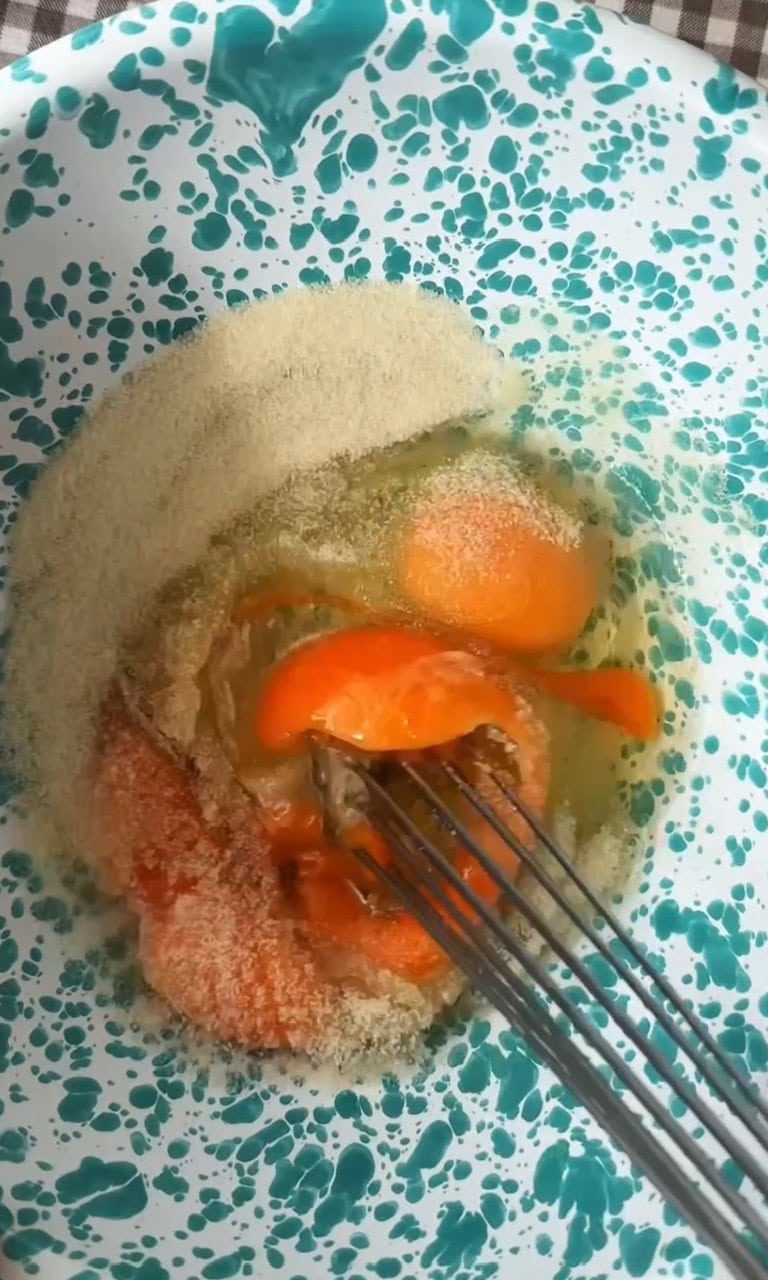 whisking eggs and sugar.