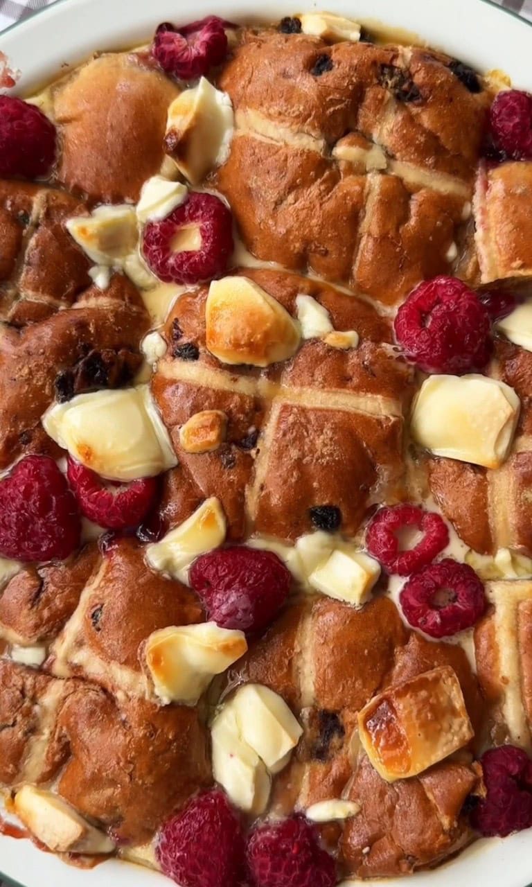 hot cross bun bread and butter pudding baked with white chocolate and raspberries.