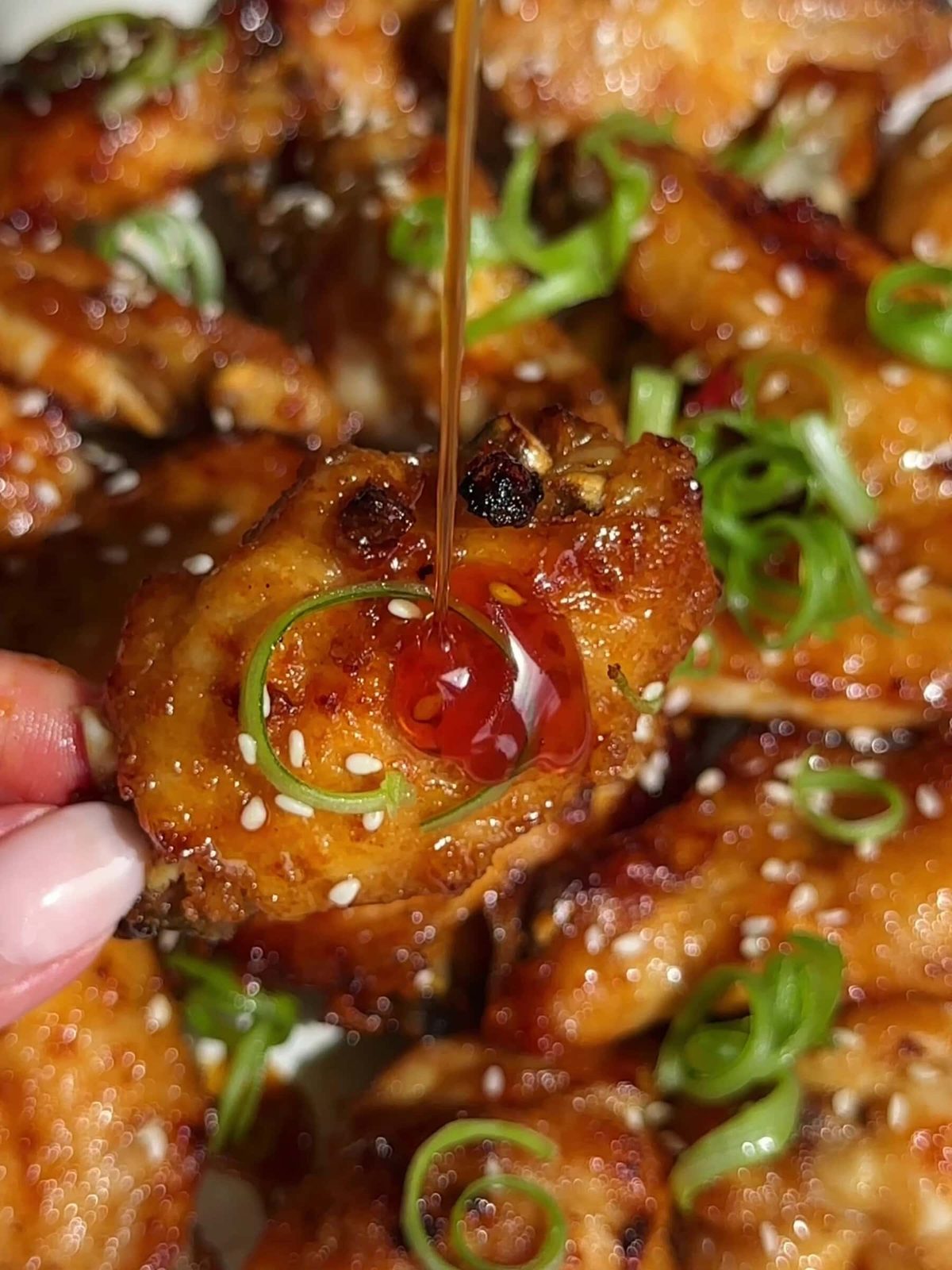 Hot Honey Chicken Wings drizzling with hot honey.