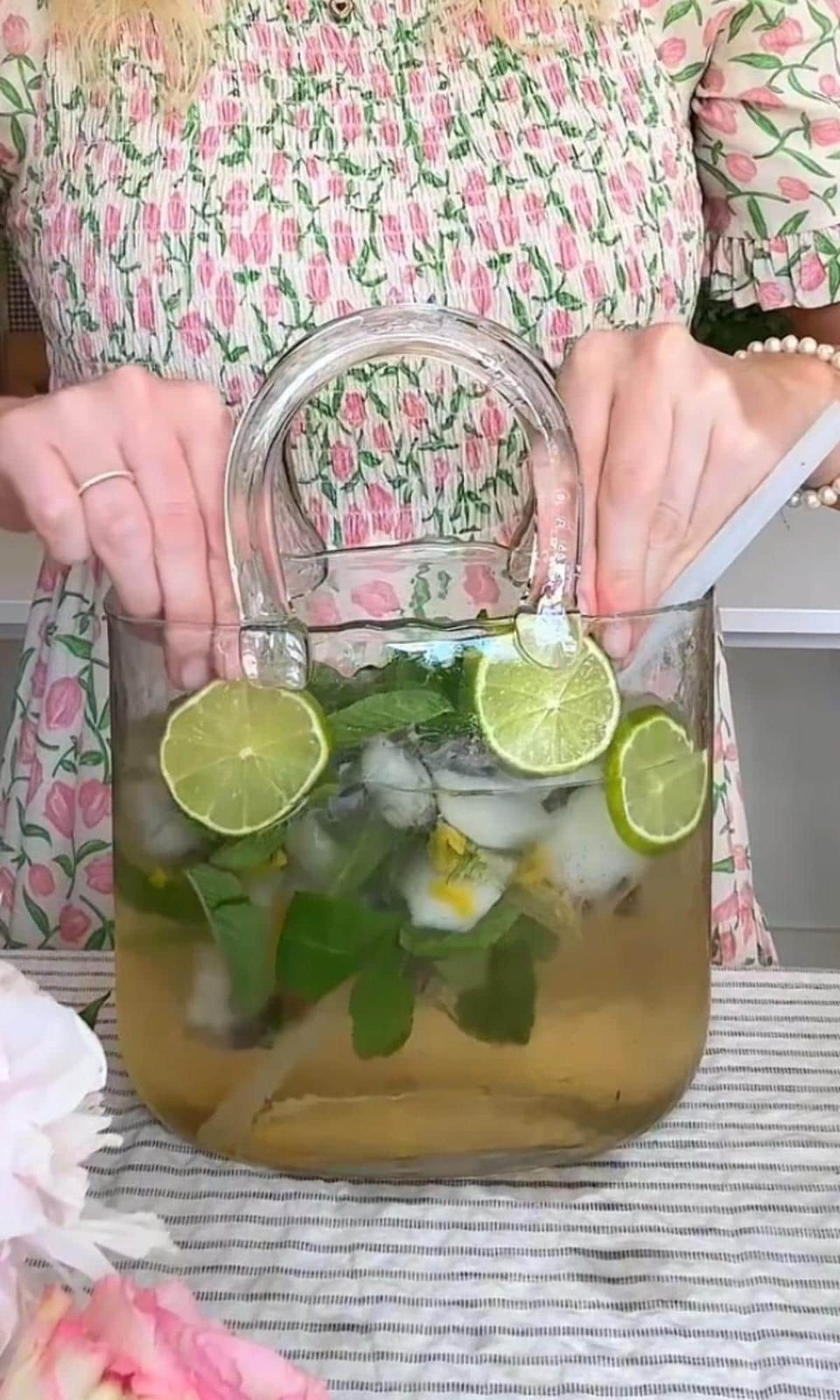 adding lime slices to hugo spritz.