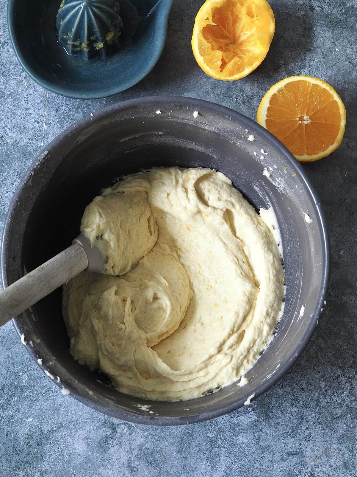 Mixing cake sponge batter in bowl.