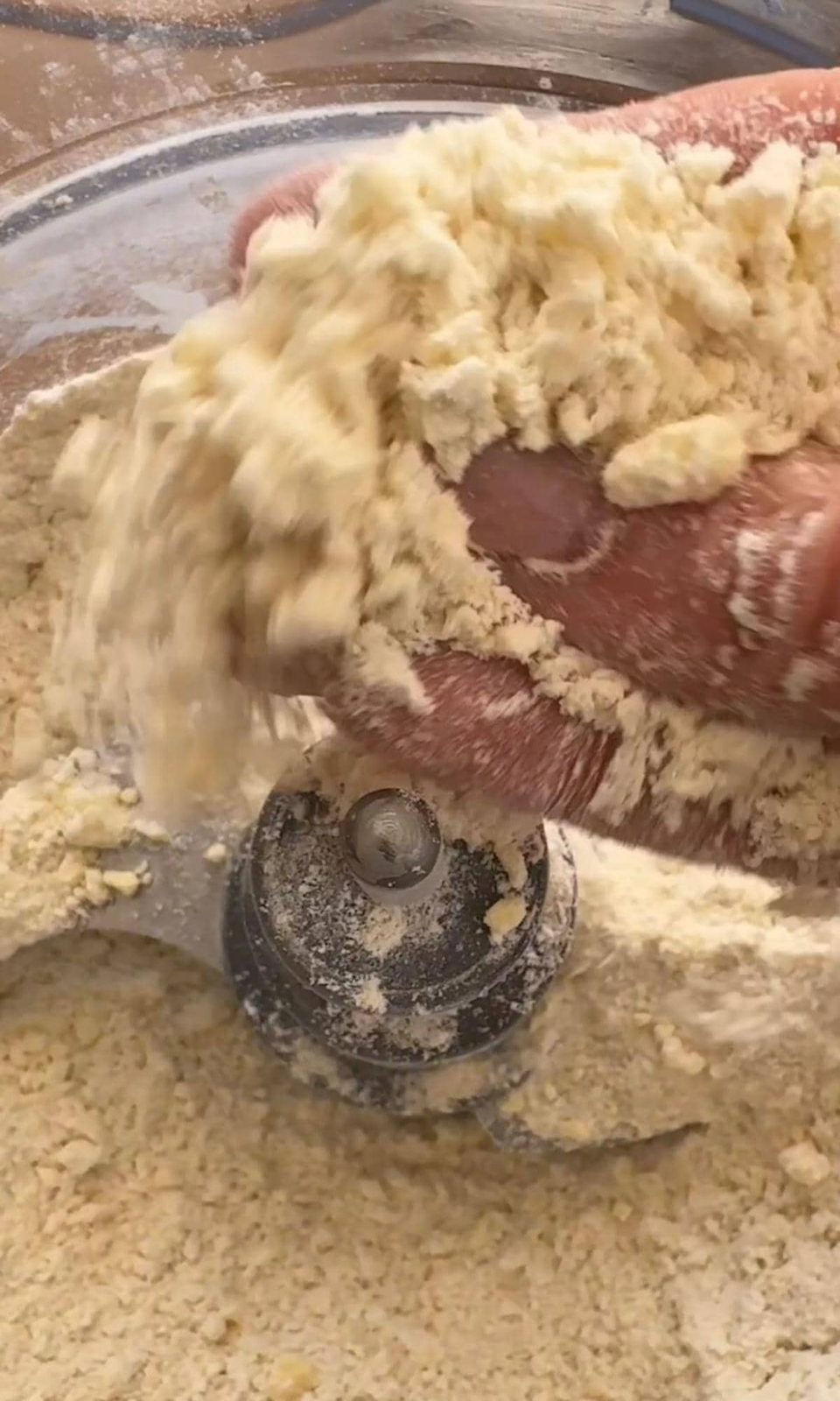 woman holding together shortcrust pastry.