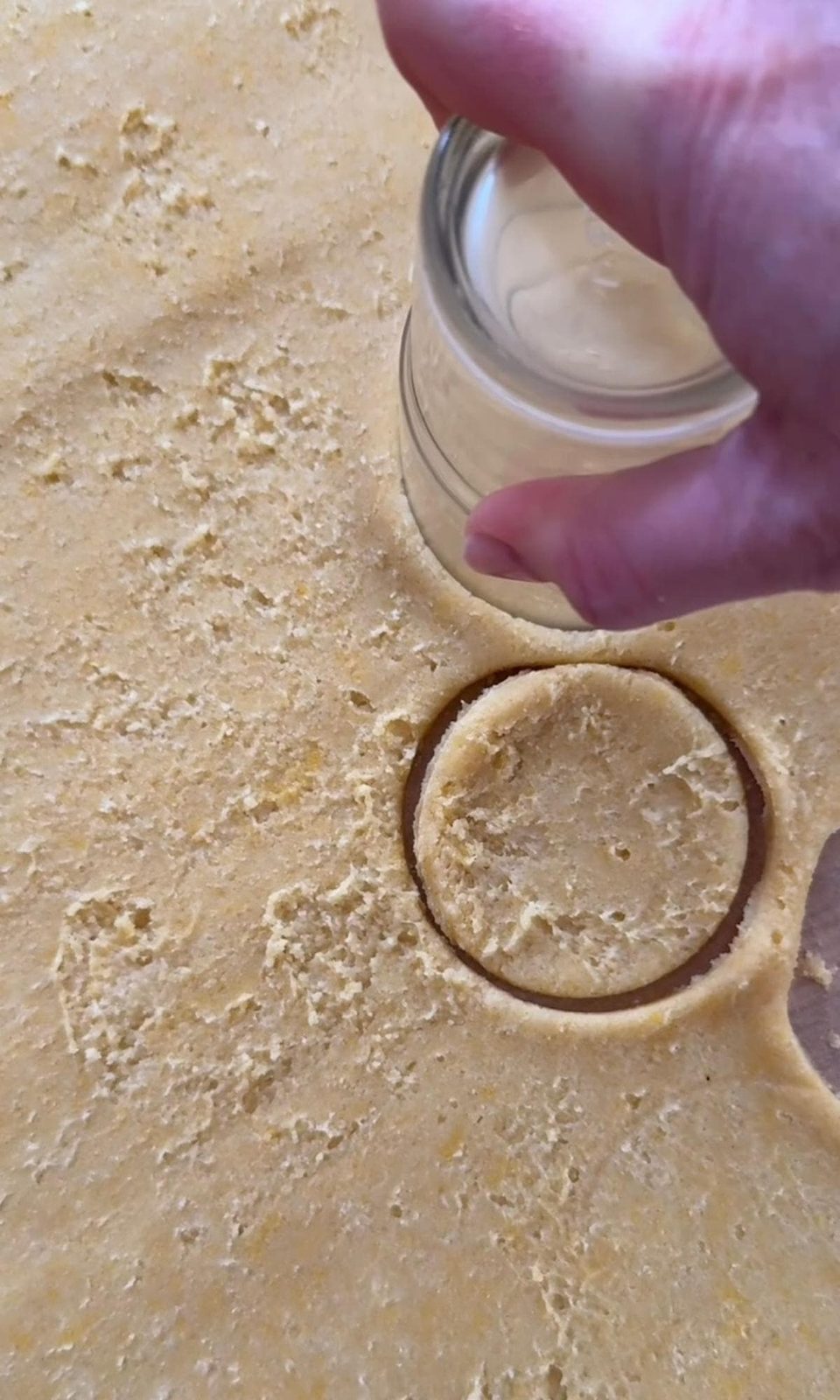 cutting out pastry for tartlets.