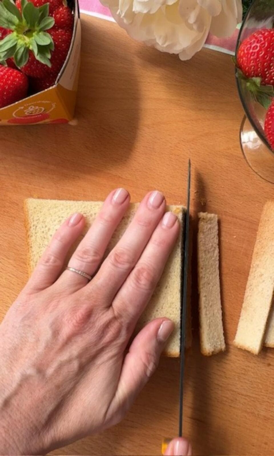 slicing crusts off japanese milk bread.