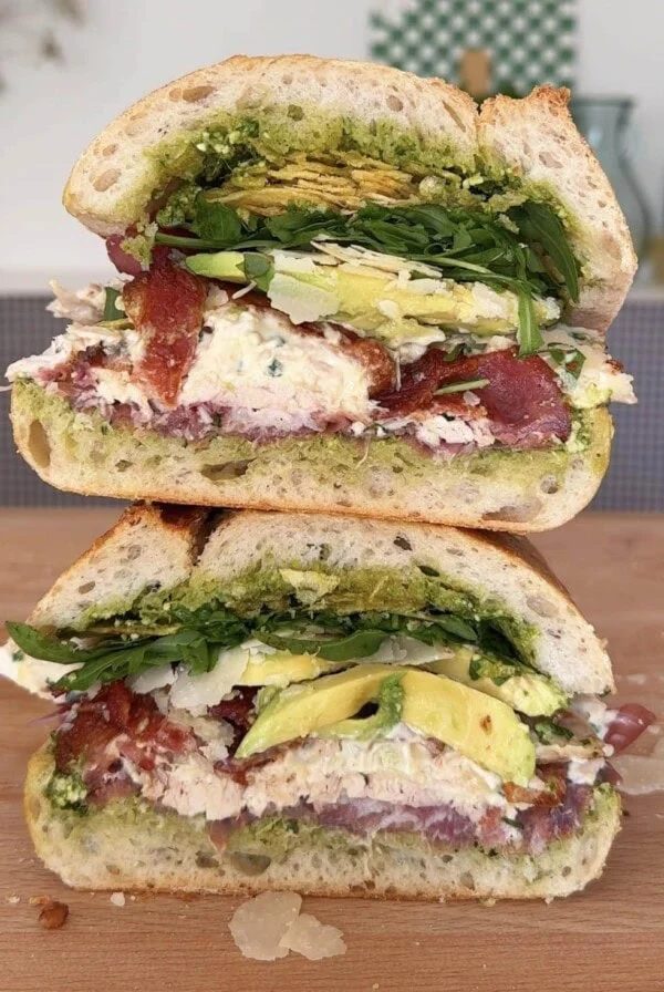 stack of chicken mayonnaise sandwich on wooden board