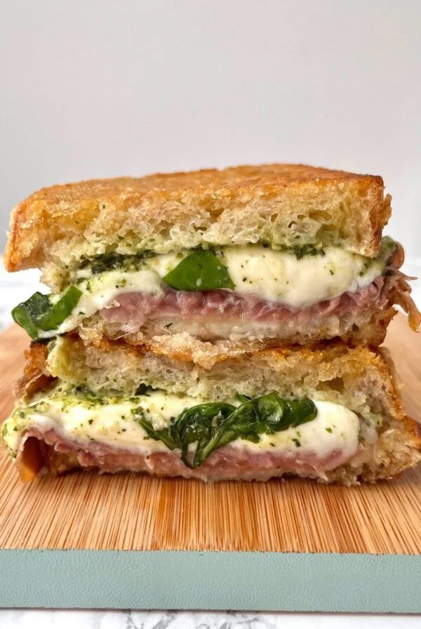 Stanley Tucci sandwich cut in half on board.
