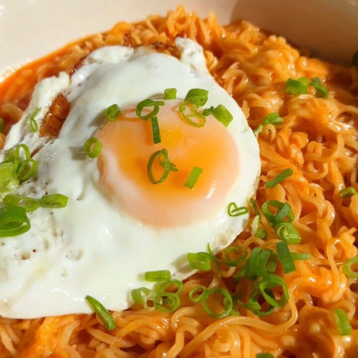 Korean Spicy Ramen Noodles with cheese and a fried egg on top