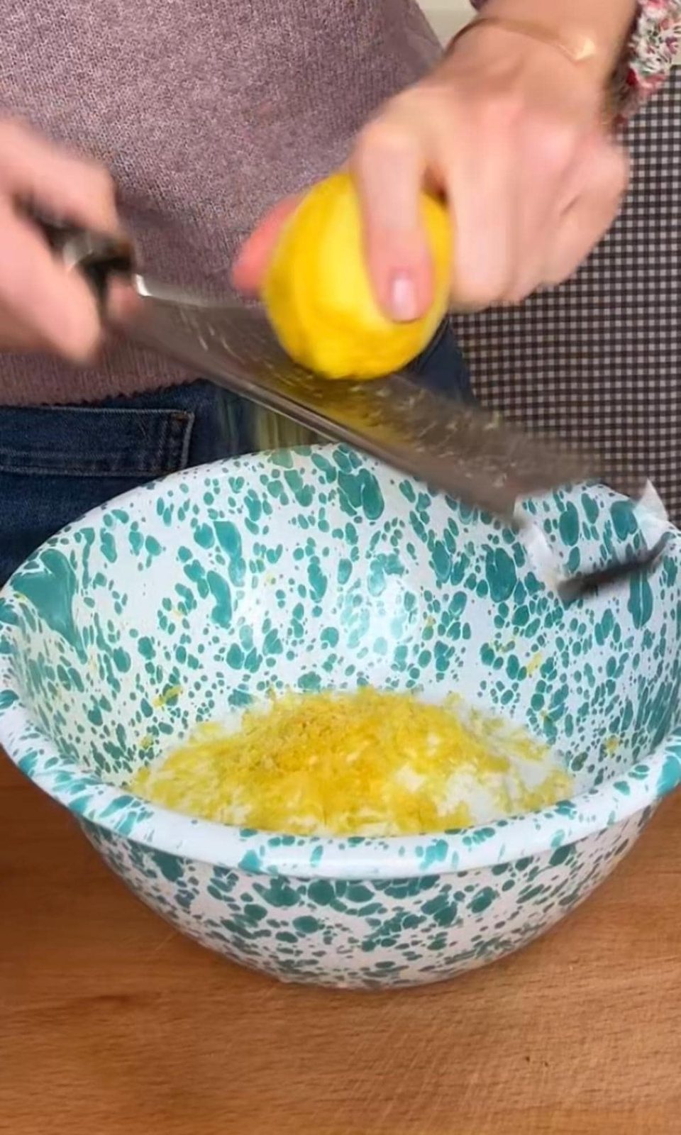 Zesting lemon into sugar.