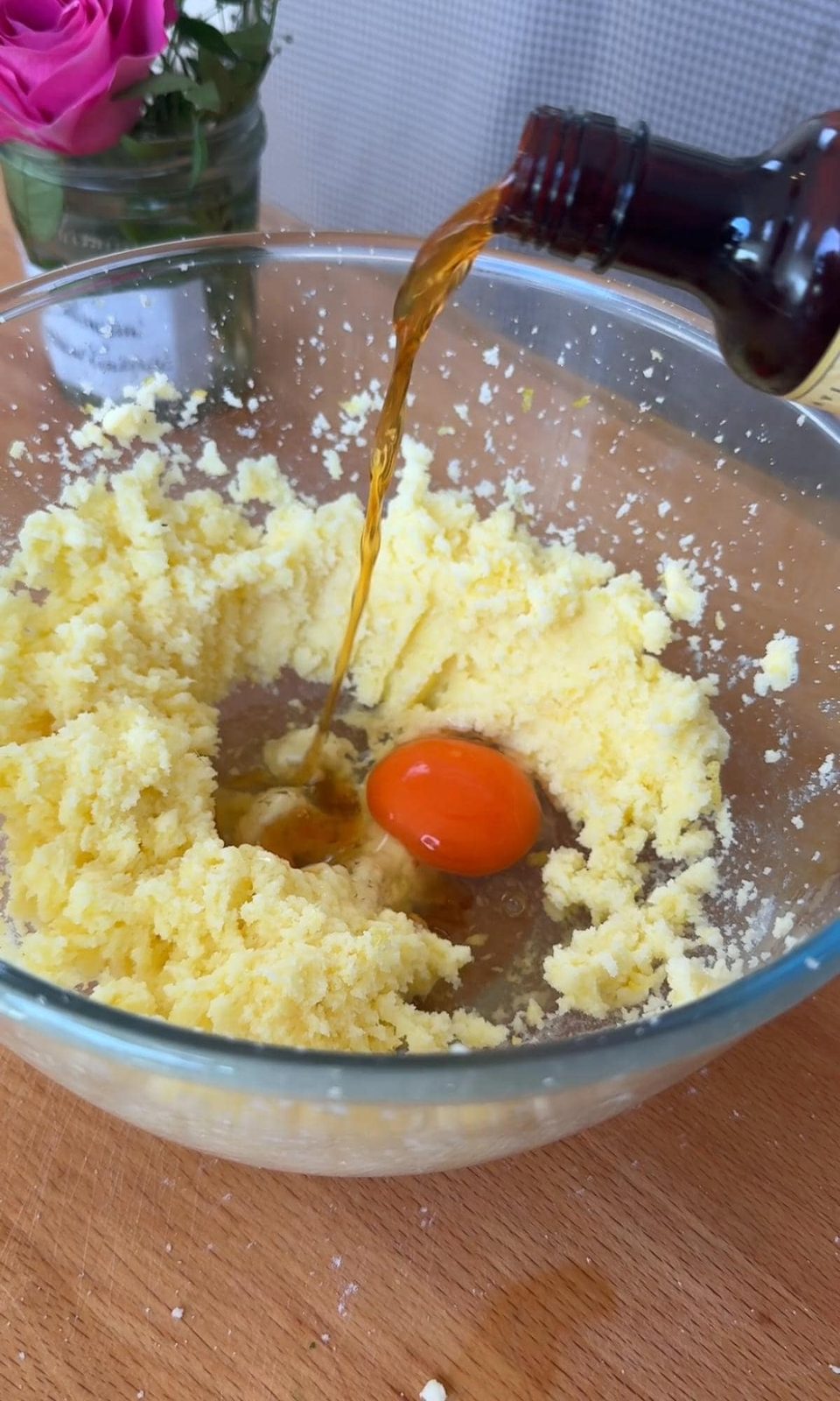Adding eggs and vanilla to the muffin batter.