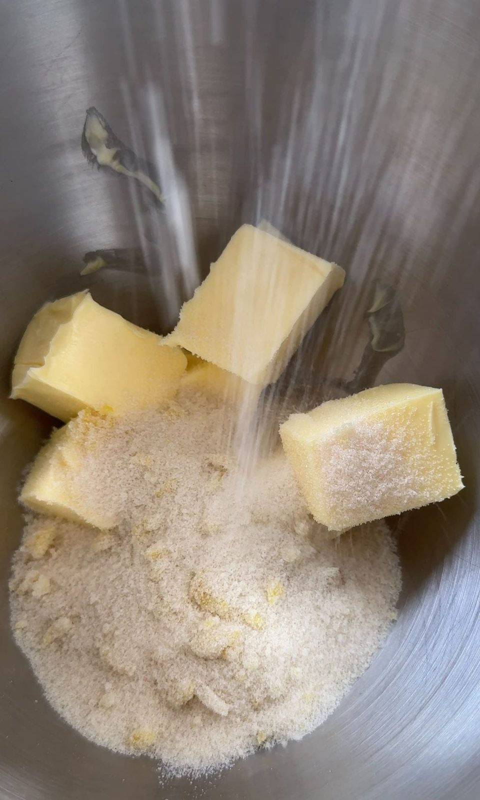 adding sugar to the butter.
