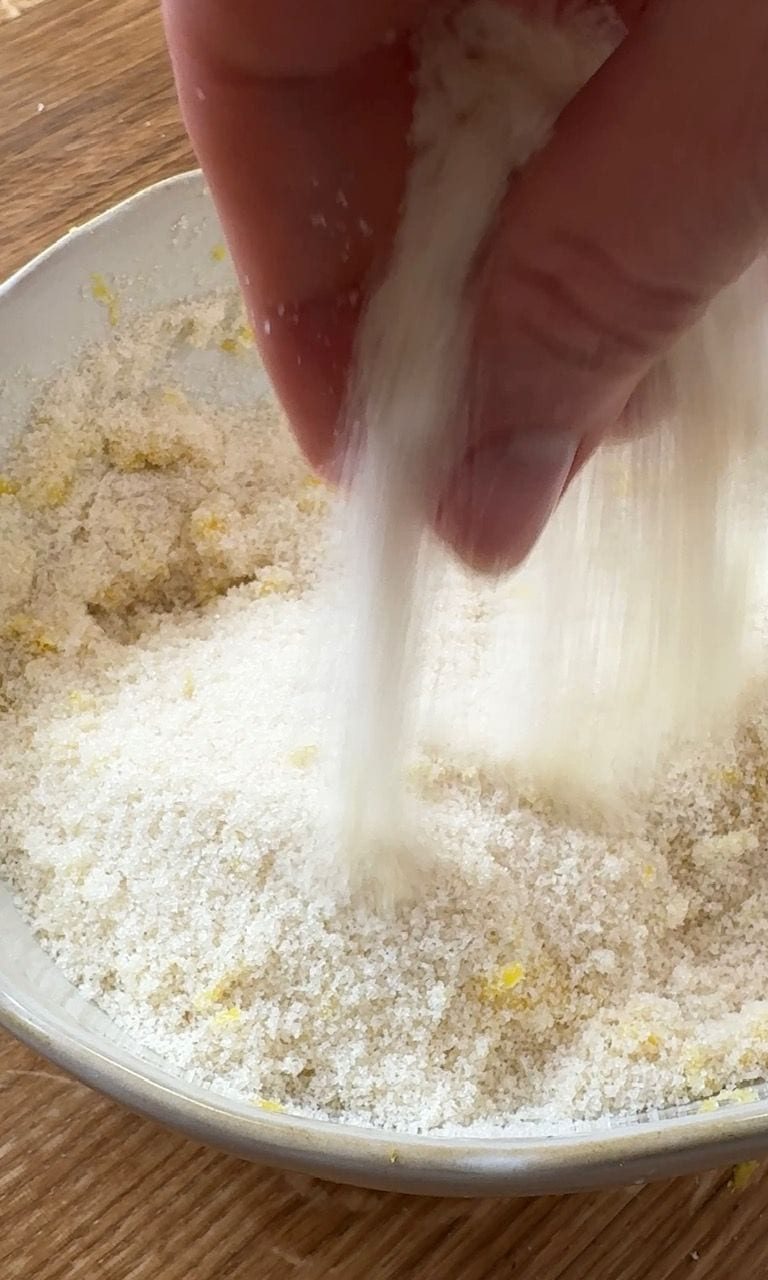rubbing lemon zest and sugar together.