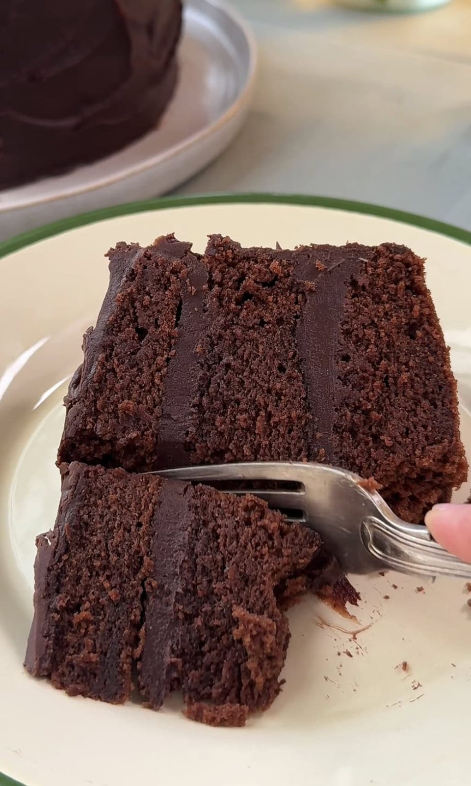 matildas chocolate cake slice with fork in it.