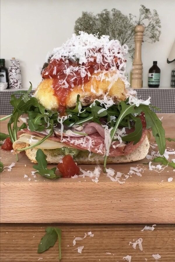fried mozzarella sandwich on a wooden board