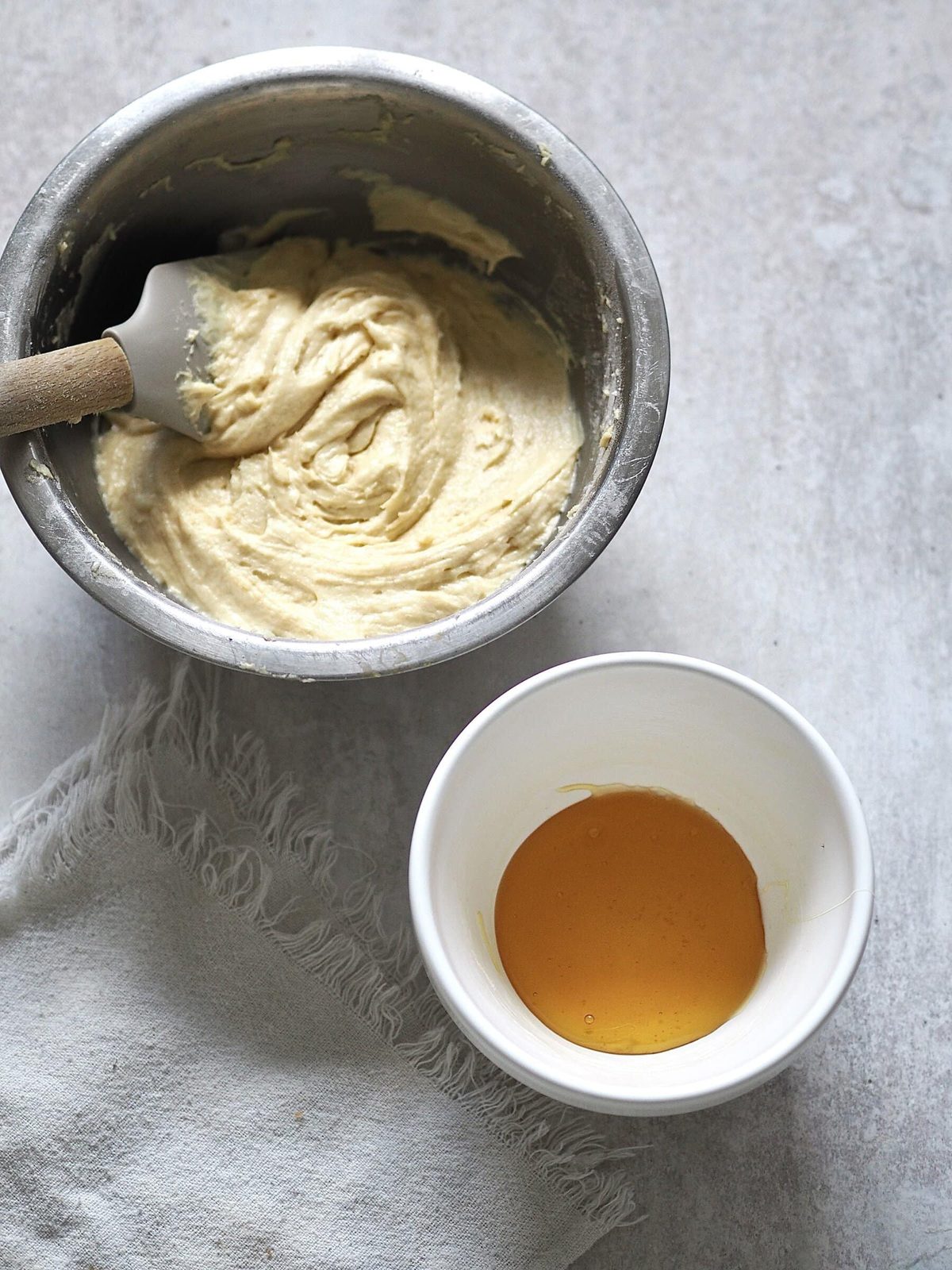 4. Spoon the golden syrup into the bottom of the prepared bowl and spread to cover the base. Spoon the batter on top.