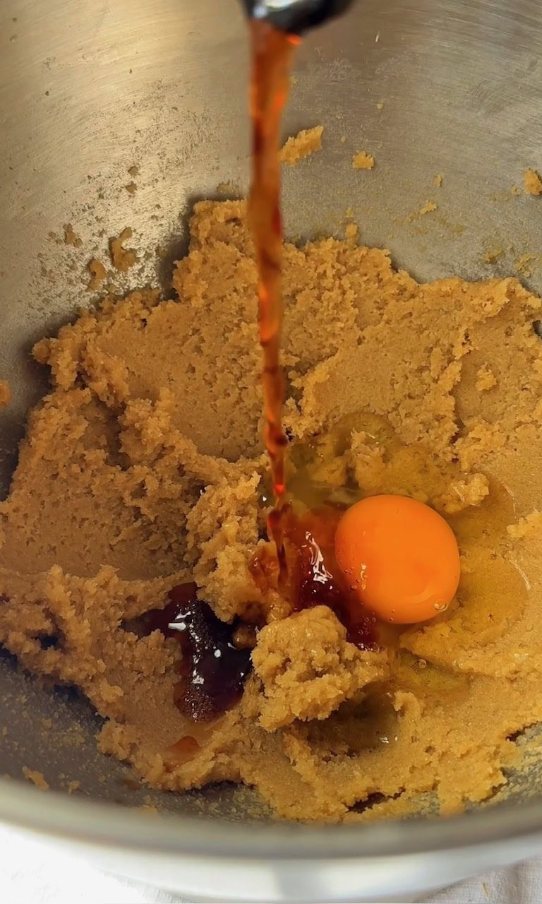 adding egg and vanilla to mini egg cookies dough.