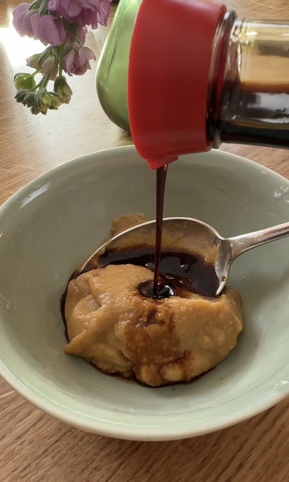 adding soy sauce to miso.