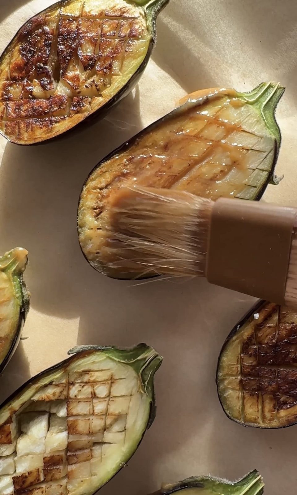 brushing miso marinade on aubergine.
