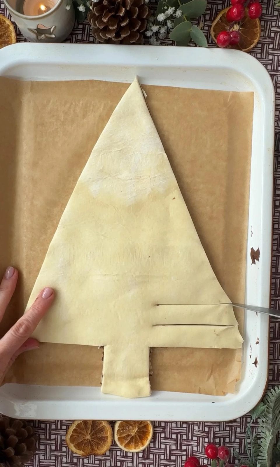slicing the branches of the christmas tree.