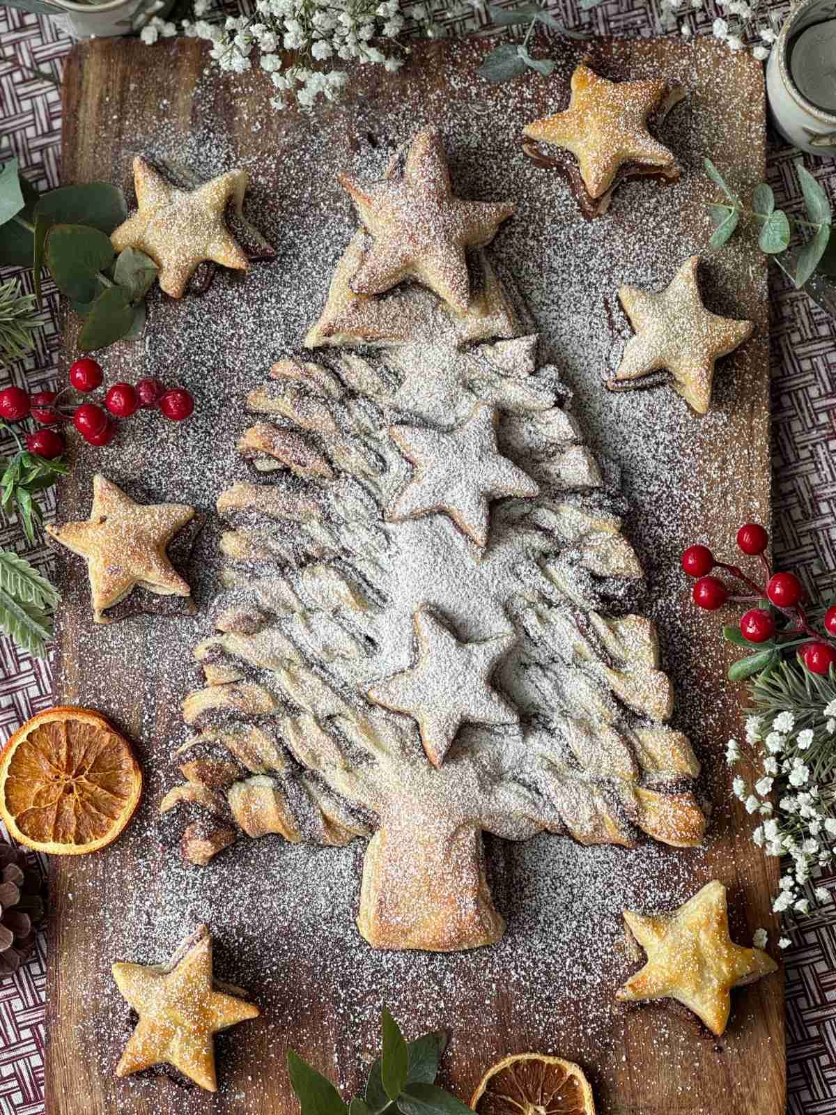 nutella puff pastry christmas tree on a wooden board.