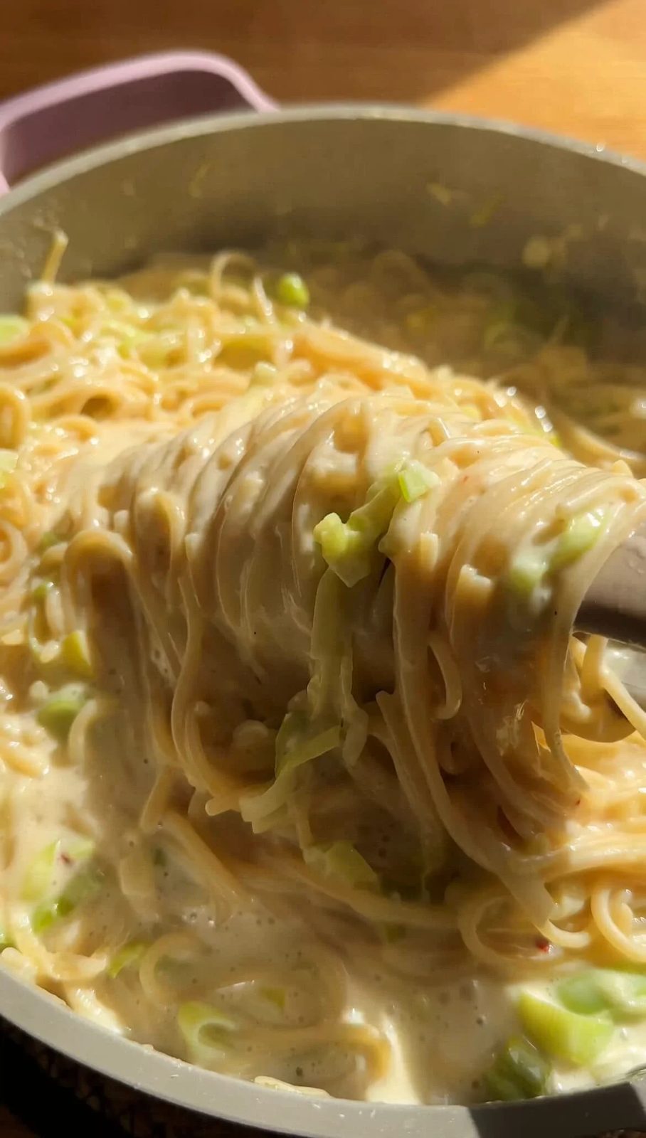 tongs twirling leek pasta