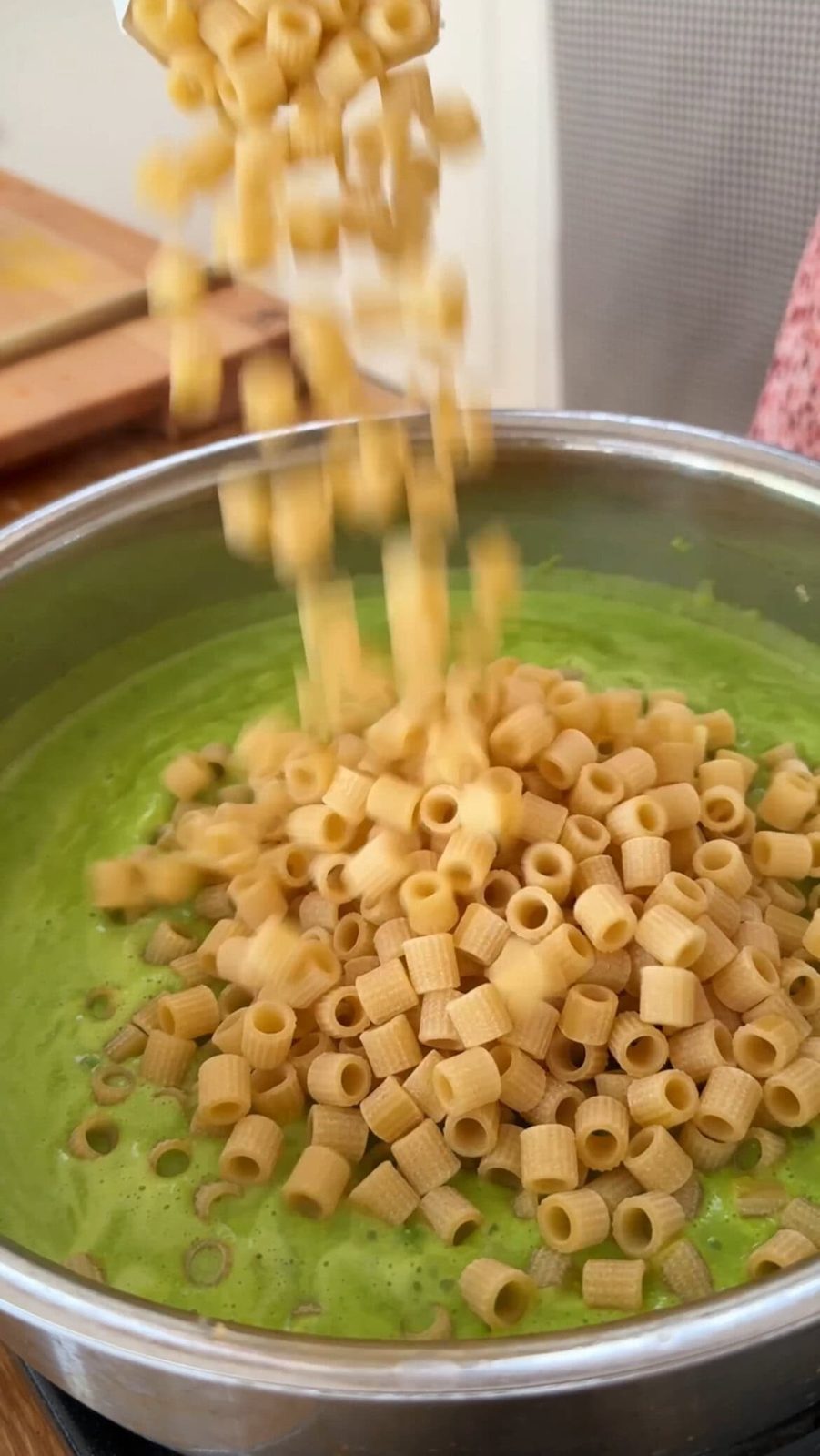 adding pasta to the peas.