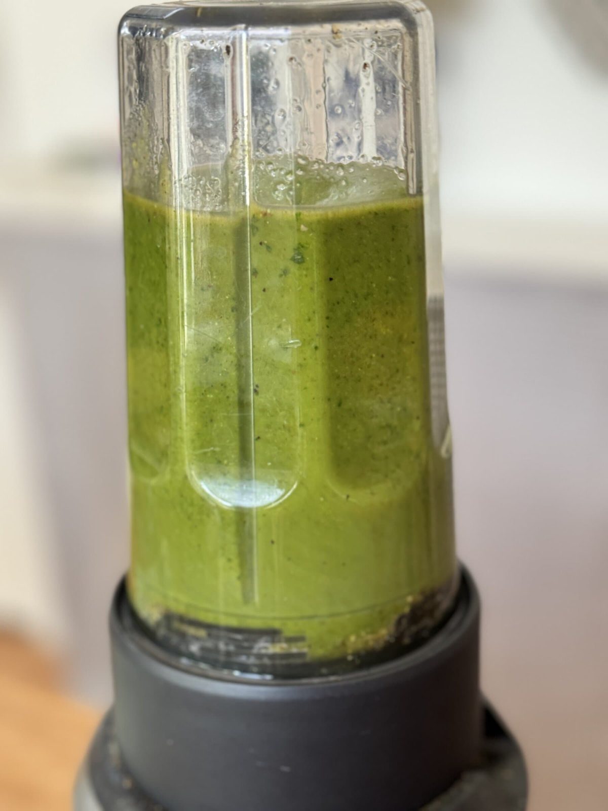 Blending pistachio pesto.