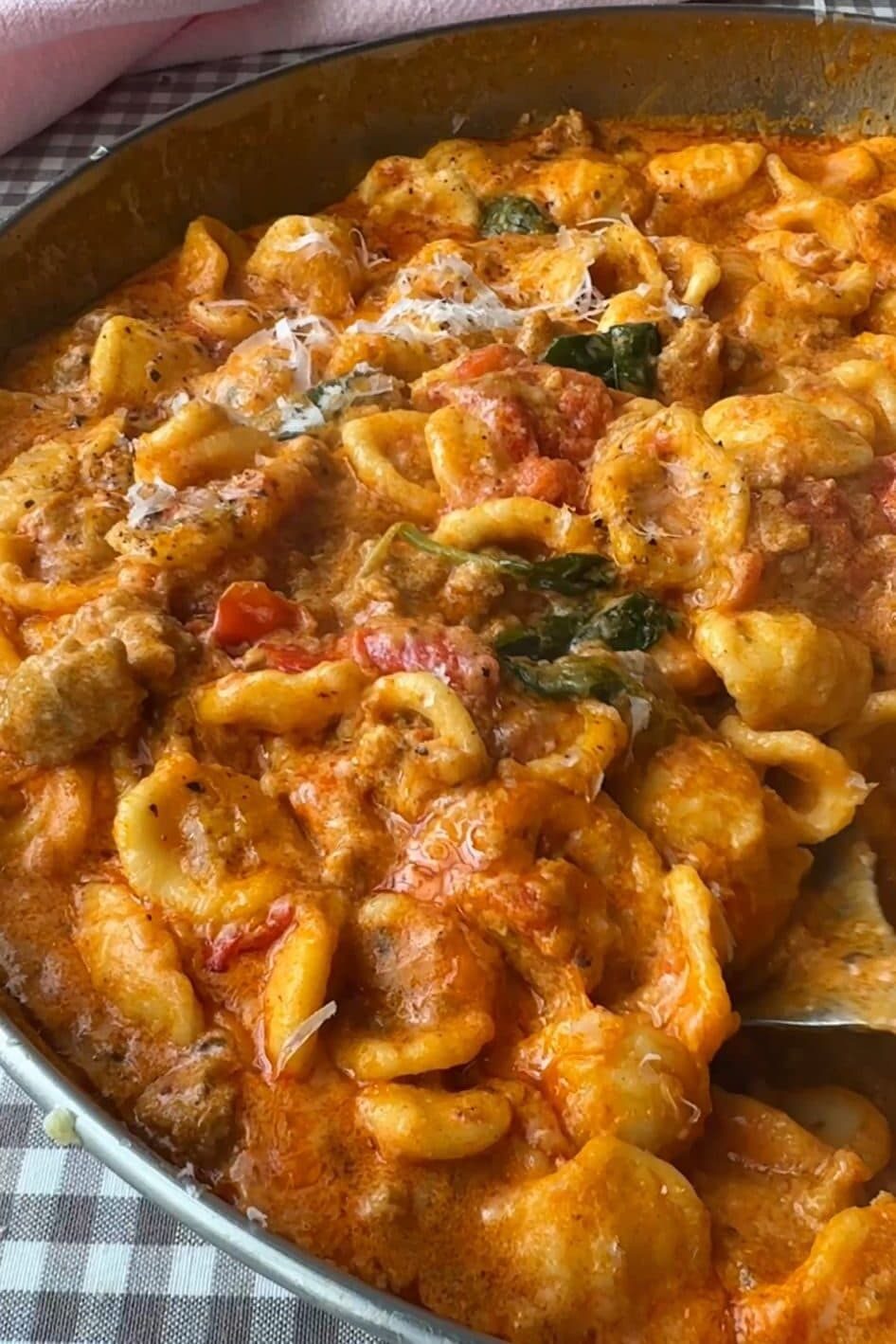stirring pasta con nduja.