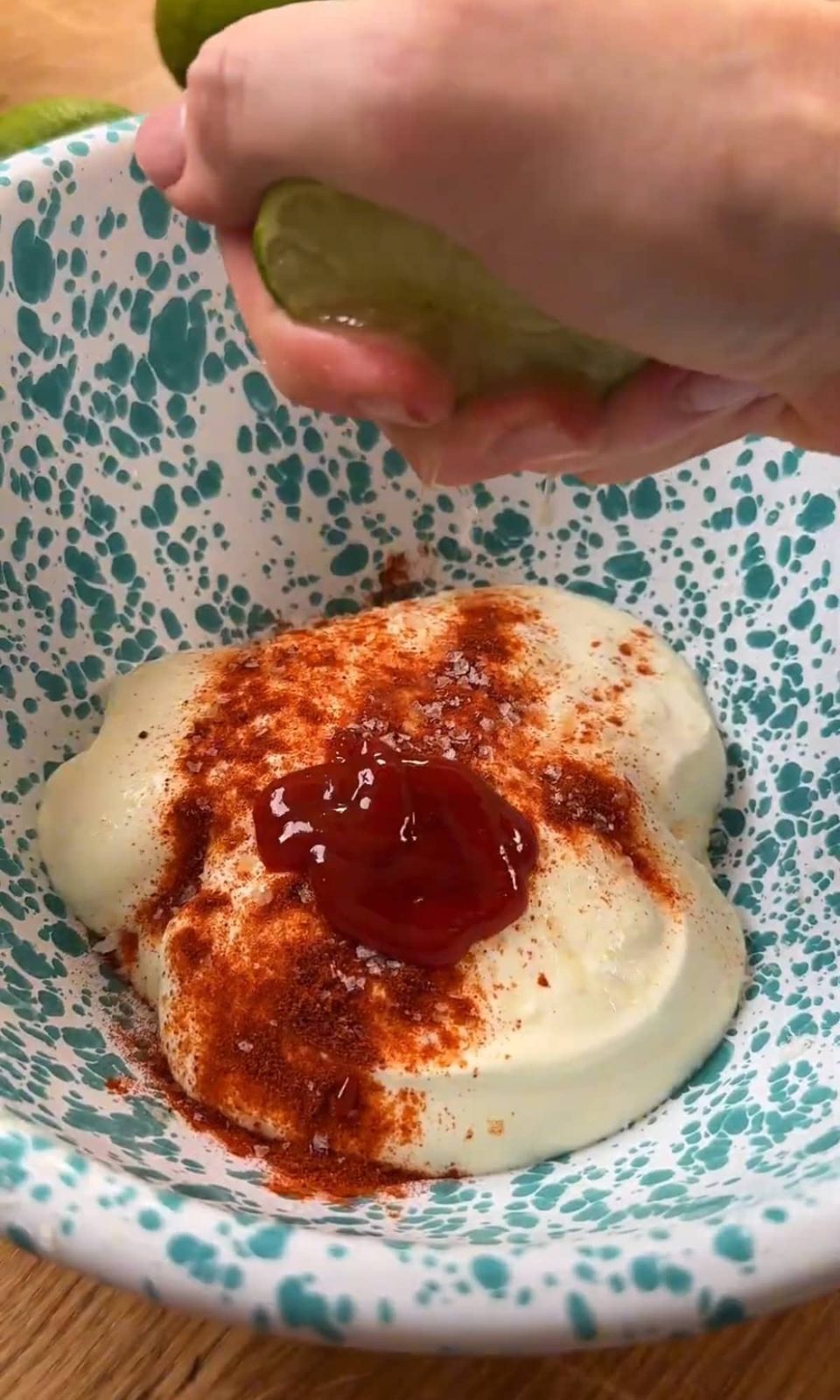 adding lime to the dressing for pastina salad.