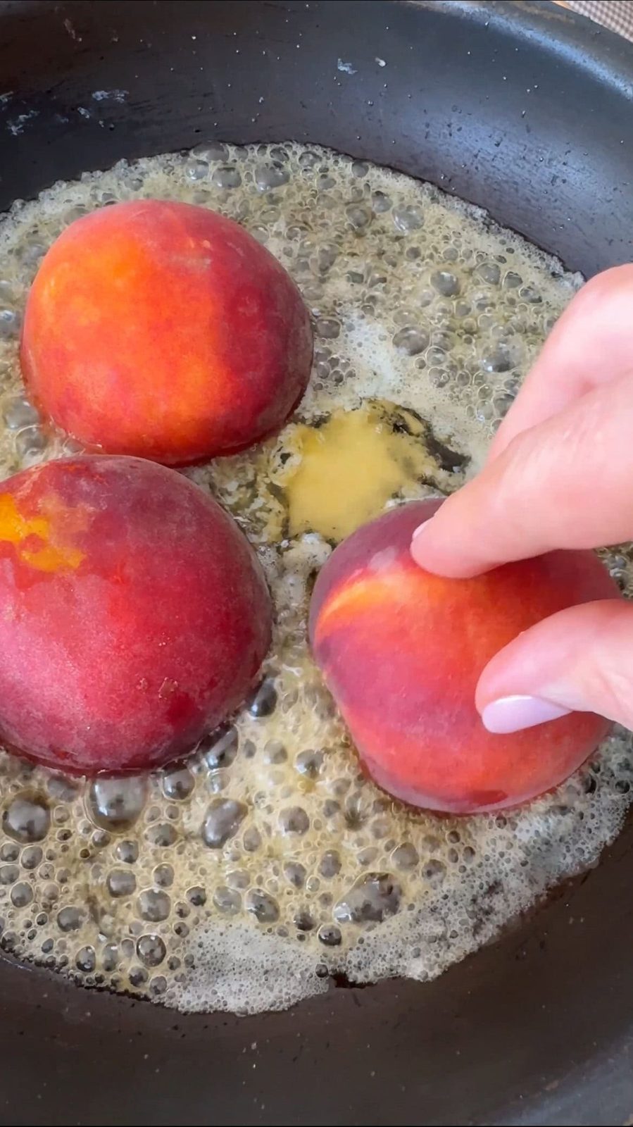 frying peaches in caramel.