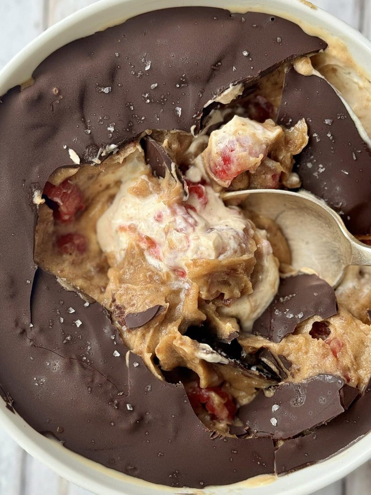 Peanut butter and yogurt bowl with spoon in.