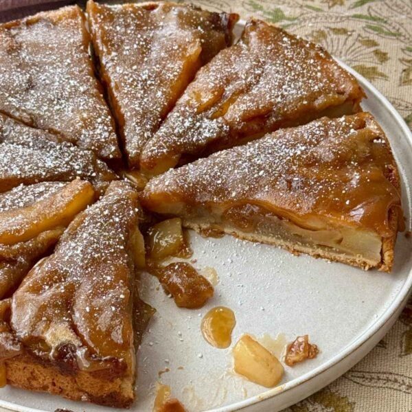 pear upside down cake on a plate.