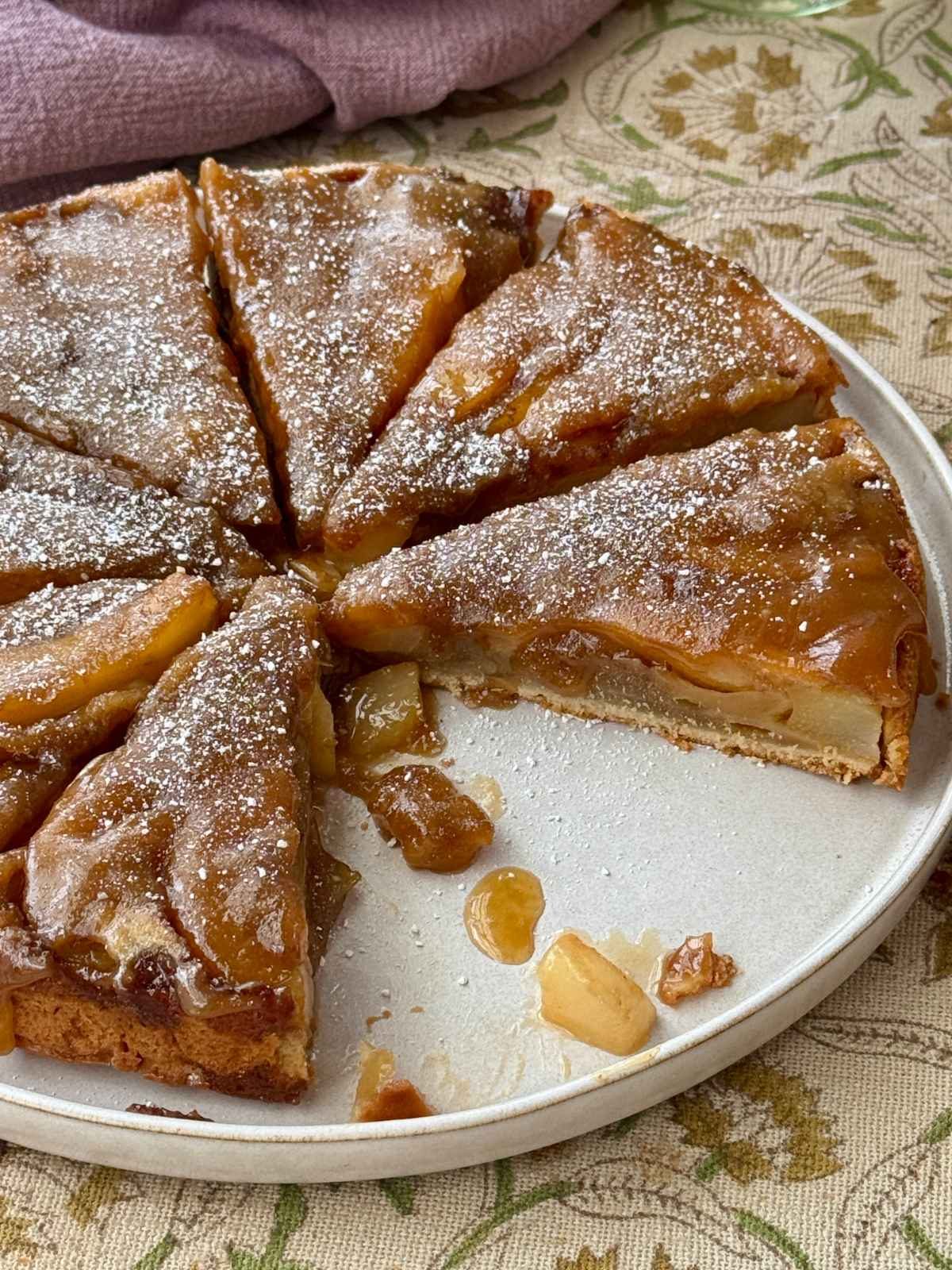 pear upside down cake on a plate.