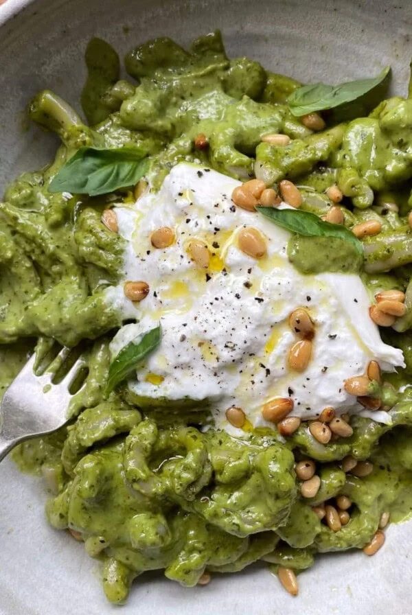 creamy pesto pasta in a bowl.