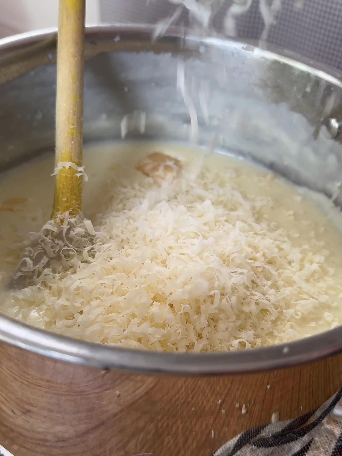 Melting cheese in bechamel sauce.