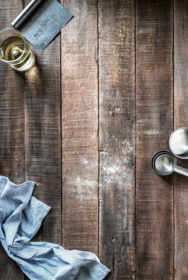 baking on a wooden board with flour and eggs.